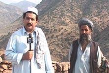 Hamid Mir stands near the graves of four bodyguards of Osama Bin Laden at a mountain top in Tora Bora, where US forces hunted in vain for the Al Qaeda leader in December 2001. Behind Mir is local Hizb-e-Islami commander Ghayas. Photograph courtesy Hamid Mir