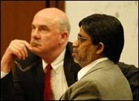 John Laskin, one of Halder's attorneys, with his client in the courtroom in Cleveland, Ohio