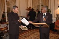 India's Ambassador to the United States Ronen Sen passes on messages of congratulation from Governor Bob Taft of Ohio and US Senator George Voinovich to Nirmal Sinha, Civil Rights Commissioner of Ohio, for reading out at the reception. Photo: Kiran Jagga