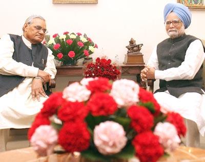 Prime Minister Manmohan Singh wishes Senior BJP leader Atal Bihari Vajpayee on his 84th birthday in New Delhi on Tuesday