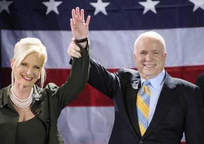 Republican presidential hopeful John McCain and his wife Cindy celebrate after the victory in the Florida Republican Presidential Primary in Miami