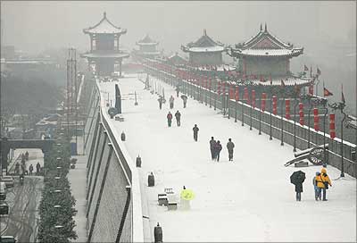 Tourists at the South Gate of the Xian City Wall after a snow storm  in Xian at Shaanxi Province in China