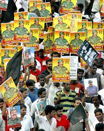 Protesters hold portraits of slain LTTE leader Prabhakaran during a rally against Sri Lanka's President Mahinda Rajapaksa in Chennai.