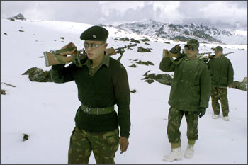 Indian soldiers patrol near the border with China in Tawang