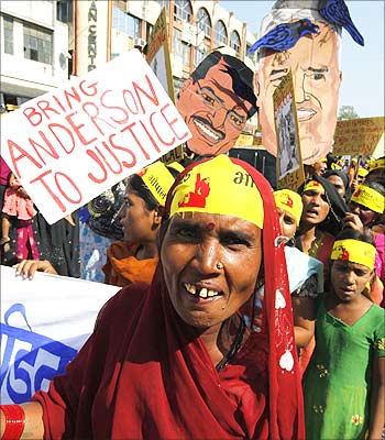 Local activists stage a demonstration to mark the 25th anniversary of the Bhopal gas disaster