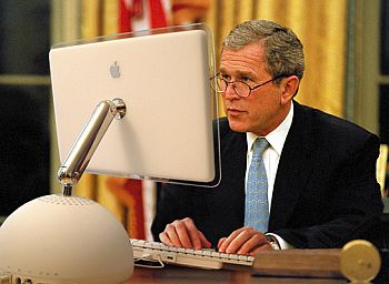 Bush in front of a computer