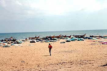 A view of the beach, with fishermen's boats lined up