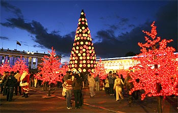 People gather at Bogota's illuminated central square ahead of Christmas