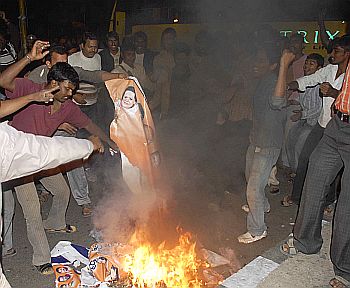 Agitators burning posters of Congress President Sonia Gandhi in Hyderabad