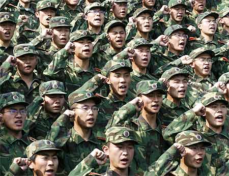 Graduates of the People's Liberation Army take an oath in Jinan in Shandong province