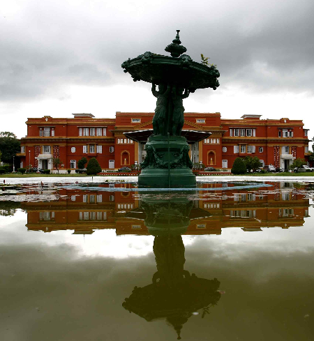 The Shital Niwas Palace or the presidential palace is reflected on a pond in Kathmandu