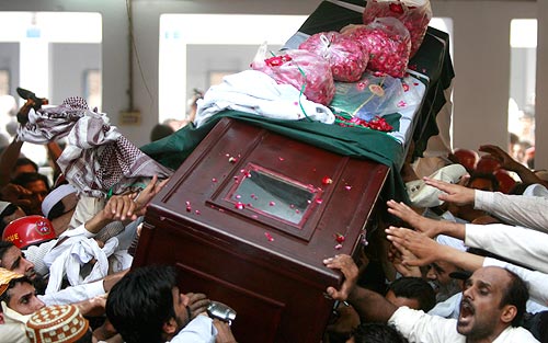 The body of Muslim cleric Sarfraz Naeemi being taken to the burial site inside Jamia Naeemia mosque