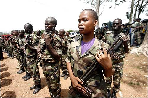 Ivory coast ex-rebel forces stand guard in the rebel stronghold of Bouake