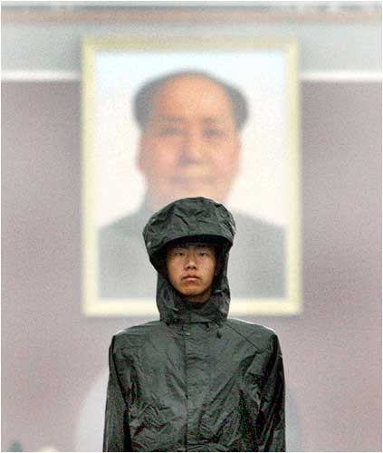 A paramilitary policeman stands guard in Tiananmen Square in Beijing