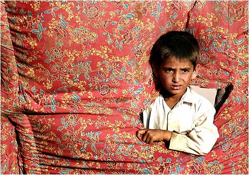 An internally displaced boy, who fled a military offensive in Swat, at a UNHCR tent