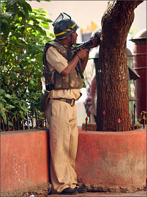 Apoliceman outside the Taj Mahal Hotel