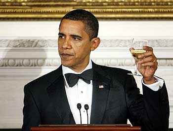 US President Barack Obama raises his glass for a toast while hosting the Governors dinner at the White House