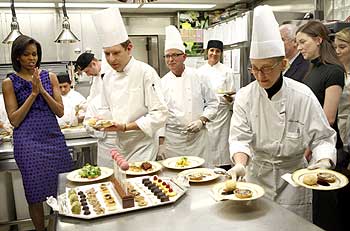Chefs bring out dishes for the Governors dinner at the White House