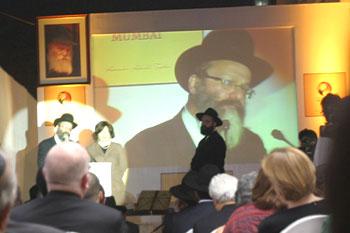 Nachman Holtzberg, Gavriel's father speaks. At his side is Gavriel's mother, Freida