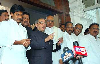 Chief Minister K Rosaiah with Finance Minister Pranab Mukherjee and the late YSR son's son Jagan Reddy at the function