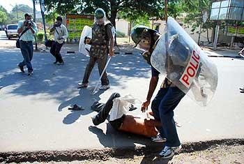 Cops pin down a protestor