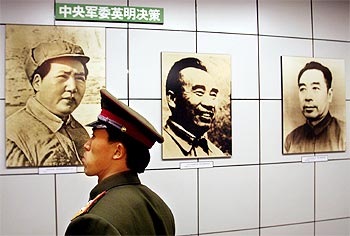 A Chinese police officer at an exhibition to mark the 50th anniversary of the liberation of Beijing.