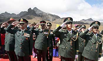 Indian soldiers and Chinese soldiers participate in celebrations to mark the 60th anniversary of the founding of the People's Republic of China, at the Indo-China border, in Arunachal Pradesh on October 1
