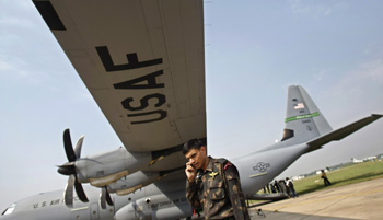 An IAF special forces 'Garuds' officer talks on his mobile phone during Cope-India-09