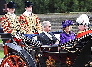 Prince Charles and Camilla, Duchess of Cornwall, ride in a carriage after the official greeting of President Patil by Queen Elizabeth