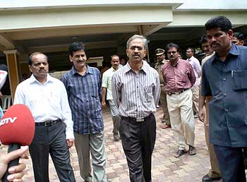 Senior police officials at Wesley's residence