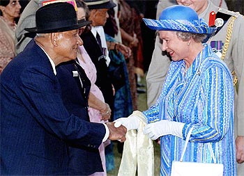 Queen Elizabeth II greets Ganju Lama, an Indian winner of the Victoria Cross, in Delhi