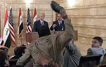 Zeidi throwing his shoes at Mr Bush in 2008