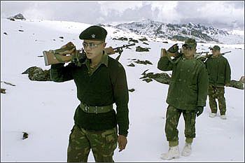 Indian soldiers patrol near the border with China in Tawang