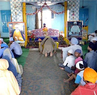 Kuldeep Singh's father Baldev Singh offers prayers