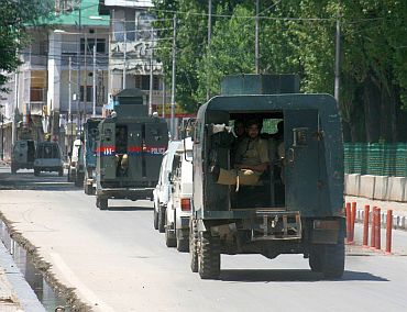 Paramilitary troopers patrol a deserted street