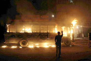 A bus torched by protestors in Karachi