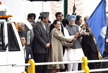 Prime Minister Manmohan Singh and Congress president Sonia Gandhi flag off a bus to Muzaffarabad