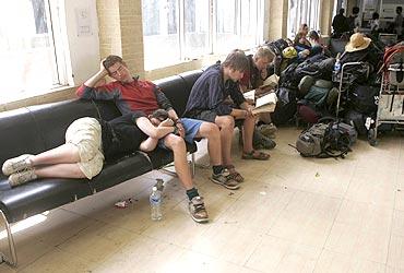 Stranded foreign tourists wait in Leh airport