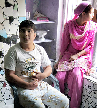 Yaawar Ibrahim, seated, is one of the angry teenagers in Srinagar