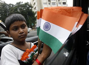 A boy sells national flags