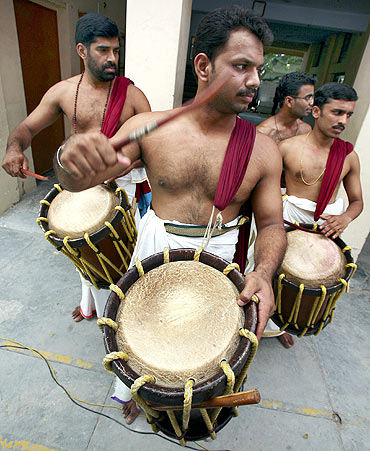 Traditionally dressed men play musical instruments 'Chenda Melam' during the Onam festivities