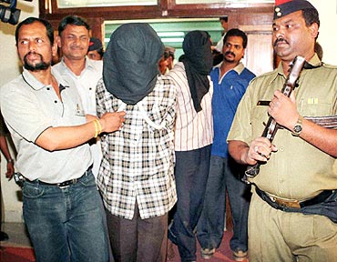 A file photo of policemen escorting alleged Pakistani militants belonging to the Lashkar-e-Tayiba