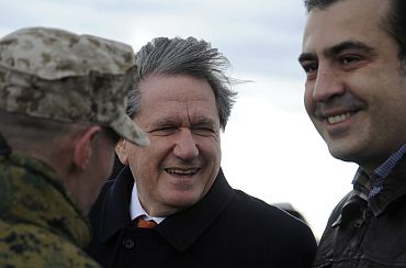 Holbrooke and Georgia's President Saakashvili watch ongoing war games outside Tbilisi