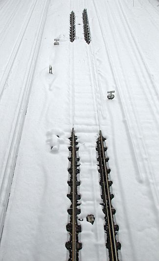 Snow covers rail tracks on the line to Gatwick Airport, in southern England