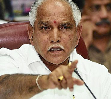 Karnataka Chief Minister B S Yedyurappa, accused of allotting prime land to sons and relatives