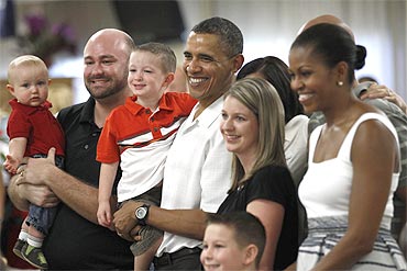 US President Barack Obama and First Lady Michelle Obama make a Christmas Day visit to soldiers and their families at Marine Corps Base Hawaii in Kaneohe