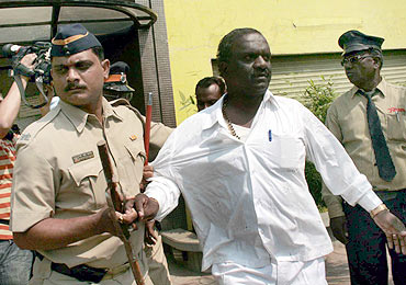 A Sena activist being taken into custody
