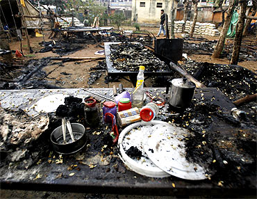 A view shows the burnt remains of a police camp attacked by Maoist rebels