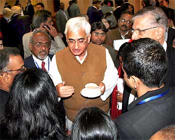 Corporate Affairs Minister Salman Khursheed peaking to some disgruntled overseas Indians at the sidelines of the ceremony on Thursday