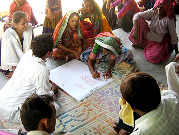 Women draw layouts to rebuild their houses in Kutch